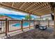 Covered patio with a view of the sparkling pool perfect for outdoor entertaining at 3047 W Sandra Ter, Phoenix, AZ 85053