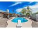 Backyard oasis with a diving pool, mature trees, and covered patio perfect for outdoor entertaining at 3047 W Sandra Ter, Phoenix, AZ 85053