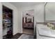 Bathroom view showing double vanity, walk in closet and doorway to main bedroom at 30517 W Lynwood St, Buckeye, AZ 85396