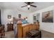 Primary bedroom with a ceiling fan, wood furniture, and a vintage-style chest at 30517 W Lynwood St, Buckeye, AZ 85396