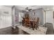 Rustic dining room with wood table, decorative rug, and unique wall decorations at 30517 W Lynwood St, Buckeye, AZ 85396