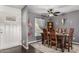 Dining room features gray walls, ceiling fan, and decorative accents at 30517 W Lynwood St, Buckeye, AZ 85396