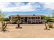 Inviting single-story home featuring a covered front porch, desert landscaping, and clearly marked street number at 30517 W Lynwood St, Buckeye, AZ 85396