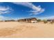 Exterior showcasing a home with a welcoming front porch, solar panels, and a spacious yard at 30517 W Lynwood St, Buckeye, AZ 85396