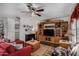 Living room with an entertainment center and a decorative rug at 30517 W Lynwood St, Buckeye, AZ 85396