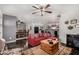 Open living room seamlessly connecting to the dining area and kitchen at 30517 W Lynwood St, Buckeye, AZ 85396