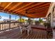 Spacious covered patio, perfect for outdoor dining and relaxing, with views of the surrounding landscape at 30517 W Lynwood St, Buckeye, AZ 85396