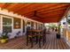 Charming covered porch featuring a rustic dining area and a cozy atmosphere at 30517 W Lynwood St, Buckeye, AZ 85396