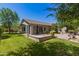 Beautiful backyard featuring lush green grass, flower beds and an exterior view of the home at 3239 S Tatum Ln, Gilbert, AZ 85297