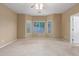 Bright, carpeted bedroom with a large window providing natural light, offering a comfortable and inviting space at 3239 S Tatum Ln, Gilbert, AZ 85297