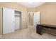 Bedroom featuring closet, door to the bathroom, and an attached desk at 3239 S Tatum Ln, Gilbert, AZ 85297