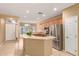 Open-concept kitchen featuring stainless steel appliances and a breakfast bar at 3239 S Tatum Ln, Gilbert, AZ 85297
