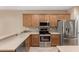 Well-equipped kitchen featuring stainless steel appliances, and ample counter space at 3239 S Tatum Ln, Gilbert, AZ 85297