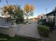 Covered patio area with plenty of room for seating with surrounding trees for privacy at 3239 S Tatum Ln, Gilbert, AZ 85297