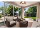 Bright sun room with sliding glass doors to the backyard, comfortable seating, and ample natural light at 3239 S Tatum Ln, Gilbert, AZ 85297
