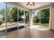 Bright sunroom with tile flooring, large glass windows and a backyard view at 3239 S Tatum Ln, Gilbert, AZ 85297