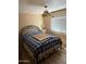 Cozy bedroom featuring a decorative metal frame bed and a window with light at 3330 E Main St # 256, Mesa, AZ 85213