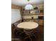 Well-lit dining area with a spacious table, chairs, and built-in storage cabinets at 3330 E Main St # 256, Mesa, AZ 85213