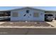 Charming home featuring desert landscaping, carport, and rustic wall decorations at 3330 E Main St # 256, Mesa, AZ 85213