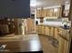 Functional kitchen featuring ample counter space, wood cabinets, and modern appliances at 3330 E Main St # 256, Mesa, AZ 85213