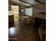 Open-concept living area featuring modern flooring, a dining table, and a view of the kitchen at 3330 E Main St # 256, Mesa, AZ 85213
