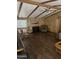 Spacious living area features wood paneling, hardwood floors, and a cozy seating arrangement at 3330 E Main St # 256, Mesa, AZ 85213