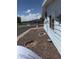 Charming single-story home with light-blue siding and decorative yard details at 3330 E Main St # 256, Mesa, AZ 85213