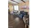 Spacious living room offering a round table, plush seating, and wood-look flooring at 3330 E Main St # 256, Mesa, AZ 85213