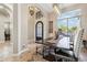 Light-filled dining room showcasing tile floors, iron transom, modern lighting, and neutral tones at 34096 N 87Th Way, Scottsdale, AZ 85266