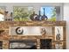 Close-up of the living room stone fireplace and decorative accents at 34096 N 87Th Way, Scottsdale, AZ 85266