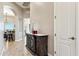 Inviting hallway with elegant furnishings, arched doorway, and tiled floors at 34096 N 87Th Way, Scottsdale, AZ 85266