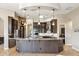 Stunning kitchen with stone accents, an island with granite countertops, and modern stainless steel appliances at 34096 N 87Th Way, Scottsdale, AZ 85266