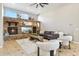 Spacious living room featuring a stone fireplace, high ceilings, and natural light at 34096 N 87Th Way, Scottsdale, AZ 85266