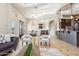Open-concept living area with a cozy seating area, kitchen, and stone-accented bar at 34096 N 87Th Way, Scottsdale, AZ 85266