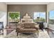 Spacious main bedroom with large windows, stylish furniture, and ample natural light at 34096 N 87Th Way, Scottsdale, AZ 85266
