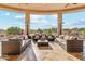 Inviting covered patio featuring comfortable seating, heaters and scenic views at 34096 N 87Th Way, Scottsdale, AZ 85266