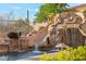 Resort-style pool with a unique rock slide and waterfall feature for luxurious outdoor enjoyment at 34096 N 87Th Way, Scottsdale, AZ 85266