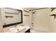Bathroom features modern fixtures and a shower-tub combo with a large vanity mirror at 3434 E Baseline Rd # 168, Phoenix, AZ 85042