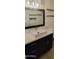 Bathroom features a vessel sink, dark wood cabinet and modern fixtures with an oversized mirror at 3434 E Baseline Rd # 168, Phoenix, AZ 85042