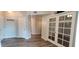 Inviting entryway with wood floors and french doors that lead to a private office space at 3434 E Baseline Rd # 168, Phoenix, AZ 85042