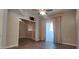 Open living room features wood floors, ceiling fan and leads to office with french doors at 3434 E Baseline Rd # 168, Phoenix, AZ 85042