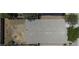 Bird's eye view of the roof and landscaped backyard with a fire pit at 40749 W Thornberry Ln, Maricopa, AZ 85138