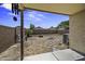 Backyard features covered patio, block wall, and fire pit perfect for entertaining at 40749 W Thornberry Ln, Maricopa, AZ 85138