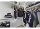 Walk-in closet with ample shelving and hanging space for all your storage needs at 40749 W Thornberry Ln, Maricopa, AZ 85138