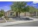 Charming single-story home with a well-manicured, low maintenance front yard and an attached two car garage at 40749 W Thornberry Ln, Maricopa, AZ 85138