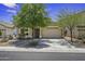Charming single-story home with a well-manicured, low maintenance front yard and an attached two car garage at 40749 W Thornberry Ln, Maricopa, AZ 85138
