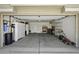 Spacious garage with ample storage cabinets, shelving, and space for vehicles and tools at 40749 W Thornberry Ln, Maricopa, AZ 85138