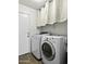 Bright and functional laundry room with modern washer and dryer units for efficient laundry care at 40749 W Thornberry Ln, Maricopa, AZ 85138