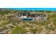 Aerial view of home's backyard featuring patio, in ground pool, spa, and desert landscaping at 41639 N 113Th Pl, Scottsdale, AZ 85262