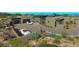 Modern exterior of this home highlighting driveway, native landscaping, and garage at 41639 N 113Th Pl, Scottsdale, AZ 85262